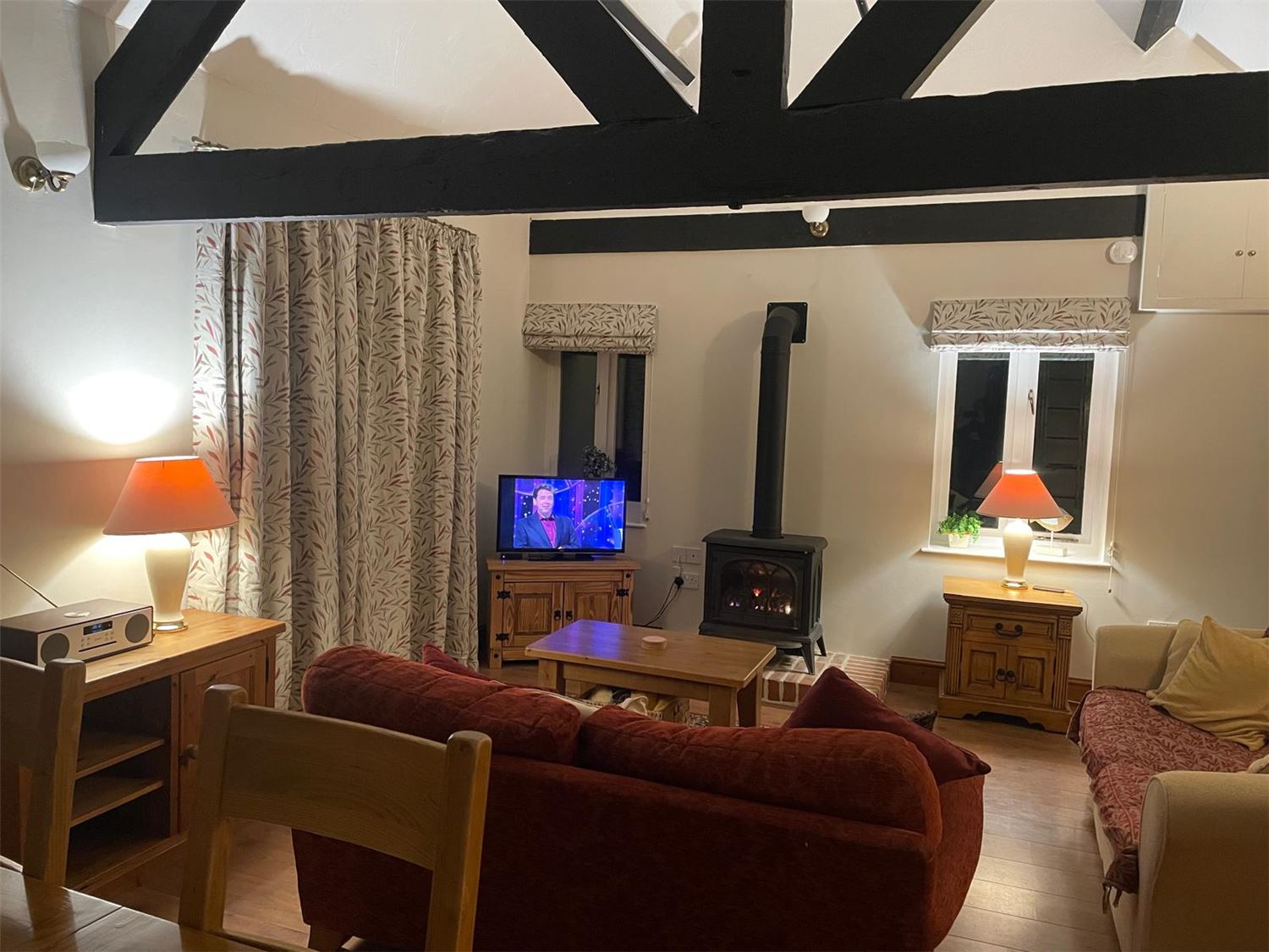 The view from the lounge looking towards the dining area where a table that seats up to 6 is situated. When seated at the table you have views over farmland and towards the sea.