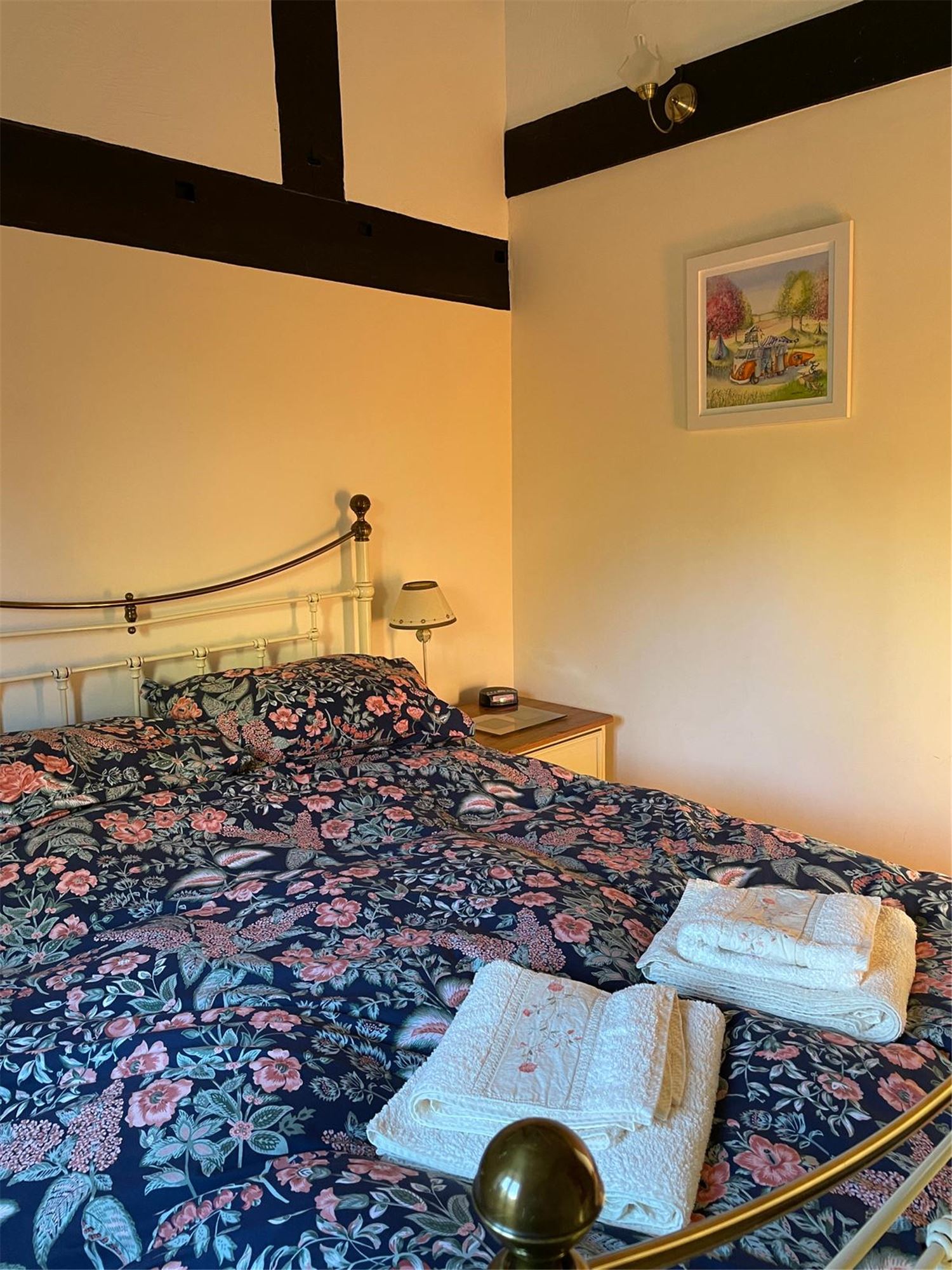 The main bedroom with a view of the bed and nightstands